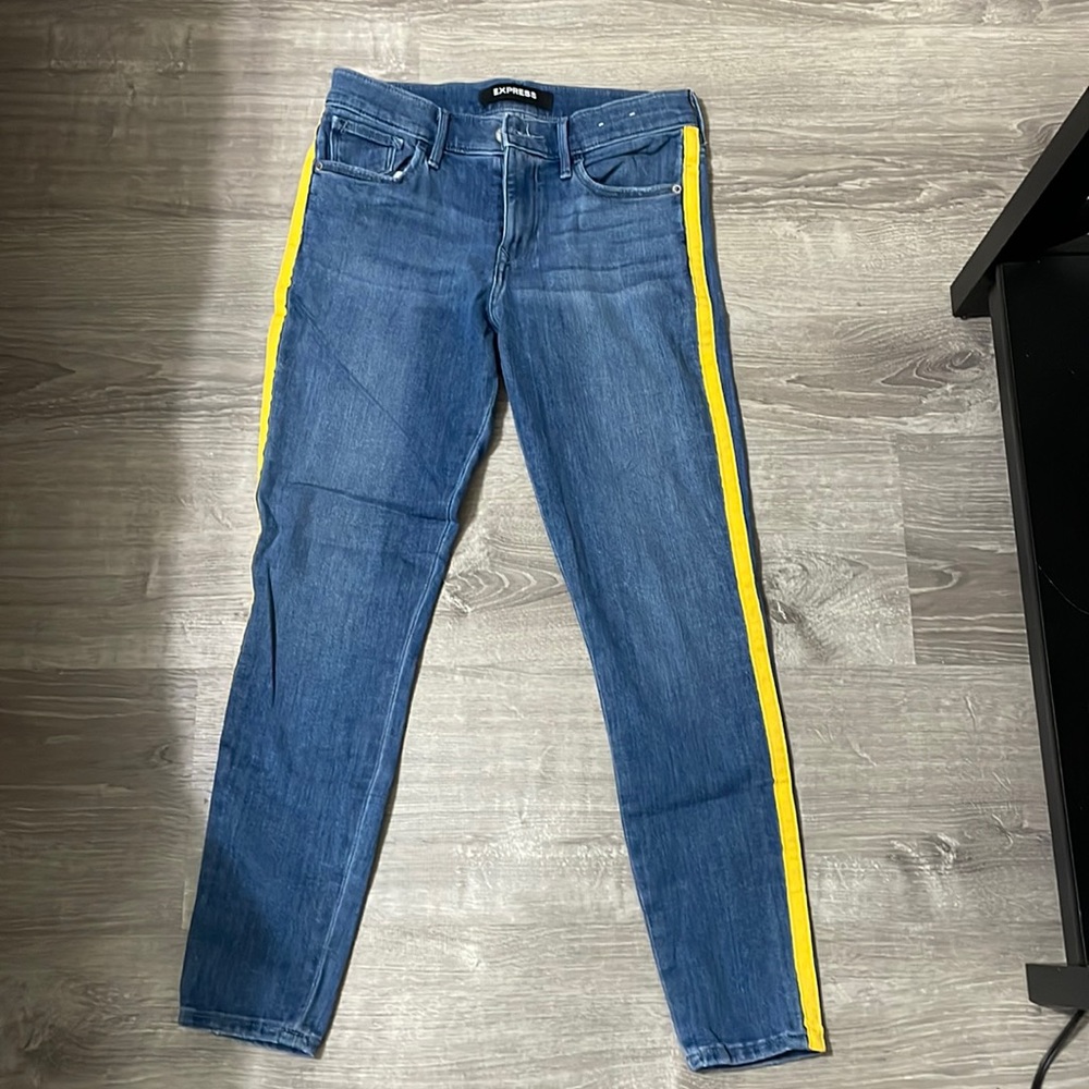 Express legging mid rise jean with yellow stripe down side. Like new!